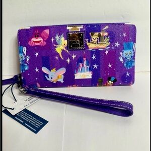 NWT. Disney Dooney & Bourke wallet wristlet with distinctive art